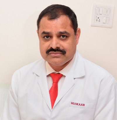 Dr. Suresh Ahlawat — Founder of Muskaan Dentals, BDS MDS DNB USA, 35+ years experience in dental implants and oral surgery