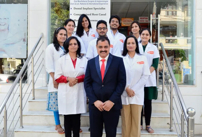 Muskaan Dentals team Gurgaon — Dr Suresh Ahlawat with staff