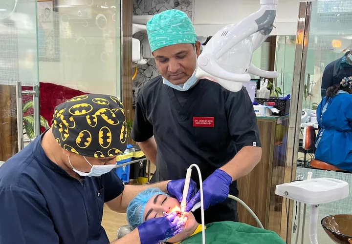 Dr Suresh Ahlawat with team and patient Muskaan Dentals Gurgaon